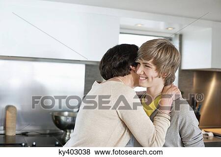 Stock Photo - Elderly woman hugging her grandson. Fotosearch