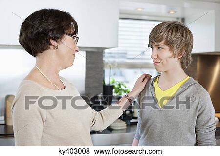 Stock Photo - Elderly woman with her grandson at a home. Fotosearch