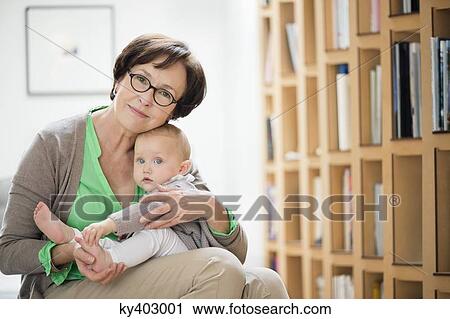 Stock Image - Portrait of a woman with her granddaughter. Fotosearch