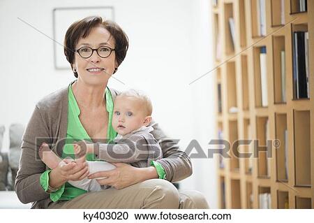 Stock Image - Portrait of a woman with her granddaughter. Fotosearch