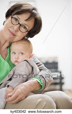 Stock Image - Portrait of a woman with her granddaughter. Fotosearch