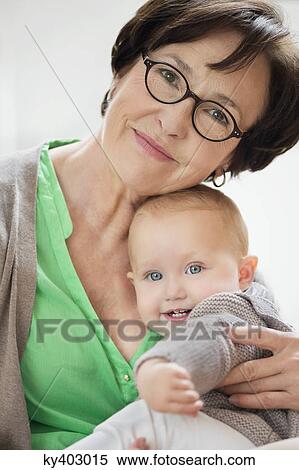 Stock Photography - Portrait of a woman with her granddaughter. Fotosearch