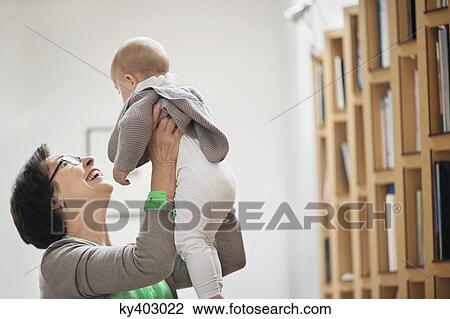 Stock Image - Woman playing with her granddaughter. Fotosearch