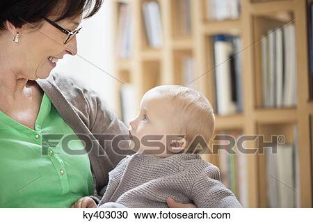 Stock Image - Woman playing with her granddaughter. Fotosearch