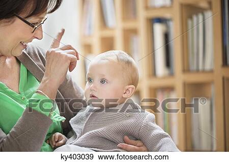 Woman playing with her granddaughter View Large Photo Image Stock Photo - Woman playing with her granddaughter. Fotosearch