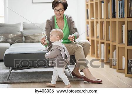 Stock Photography - Woman playing with her granddaughter. Fotosearch