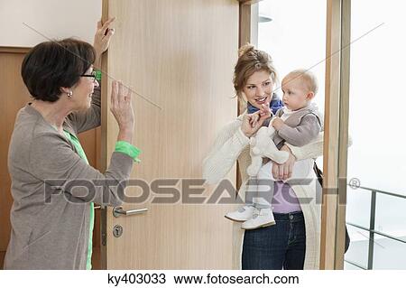 Woman waving to her daughter View Large Photo Image Stock Image - Woman waving to her daughter. Fotosearch