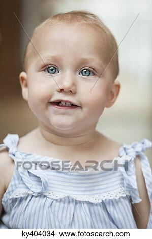 Close-up of a baby girl smiling View Large Photo Image Picture - Close-up of a baby girl smiling. Fotosearch