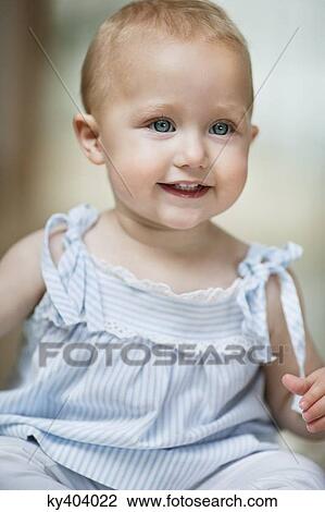 Close-up of a baby girl smiling View Large Photo Image Stock Image - Close-up of a baby girl smiling. Fotosearch