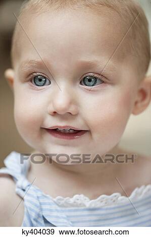 Stock Photo - Close-up of a baby girl smiling. Fotosearch