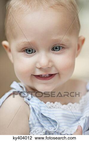 Stock Image - Close-up of a girl smiling. Fotosearch