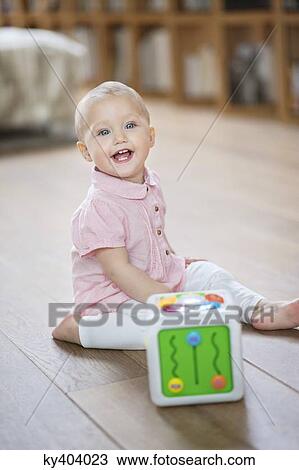 Portrait of a baby girl laughing View Large Photo Image Stock Image - Portrait of a baby girl laughing. Fotosearch