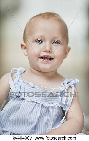 Portrait of a baby girl smiling View Large Photo Image Stock Photo - Portrait of a baby girl smiling. Fotosearch