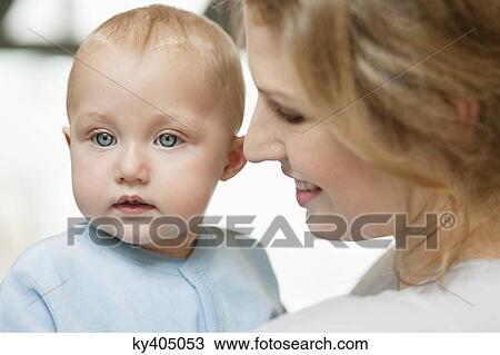 Close-up of a woman with her baby girl View Large Photo Image Stock Image - Close-up of a woman with her baby girl. Fotosearch