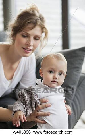 Close-up of a woman with her daughter View Large Photo Image Stock Photograph - Close-up of a woman with her daughter. Fotosearch