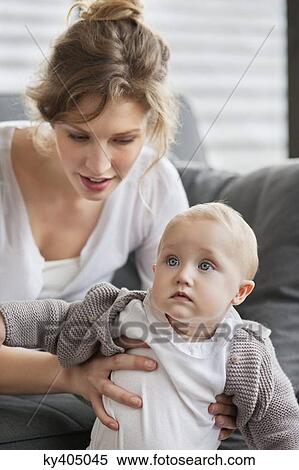 Close-up of a woman with her daughter View Large Photo Image Stock Photography - Close-up of a woman with her daughter. Fotosearch