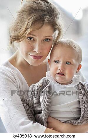 Portrait of a woman with her daughter View Large Photo Image Stock Photo - Portrait of a woman with her daughter. Fotosearch