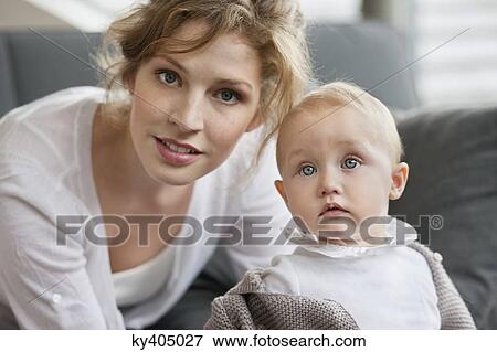 Portrait of a woman with her daughter View Large Photo Image Stock Photo - Portrait of a woman with her daughter. Fotosearch
