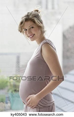 Pregnant woman smiling View Large Photo Image Stock Image - Pregnant woman smiling. Fotosearch