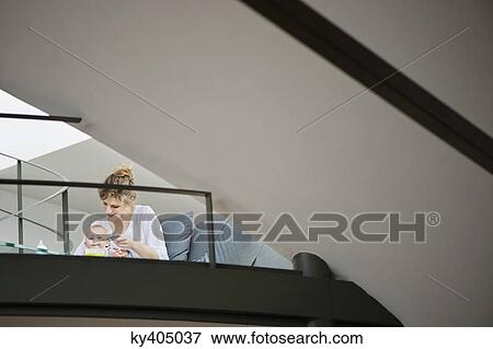 Woman feeding her daughter View Large Photo Image Stock Photo - Woman feeding her daughter. Fotosearch