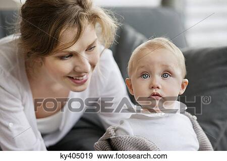 Woman playing with her daughter View Large Photo Image Stock Photo - Woman playing with her daughter. Fotosearch