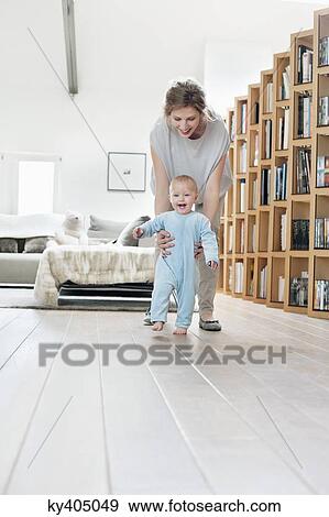 Stock Photo - Woman playing with her daughter. Fotosearch
