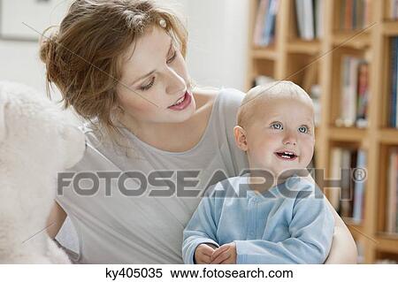 Woman playing with her daughter View Large Photo Image Stock Photography - Woman playing with her daughter. Fotosearch