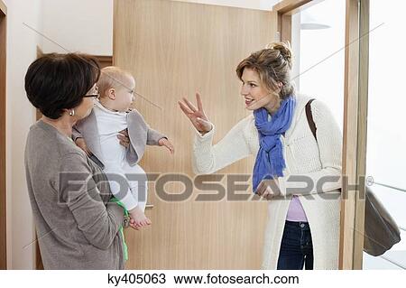 Woman waving to her daughter View Large Photo Image Stock Image - Woman waving to her daughter. Fotosearch