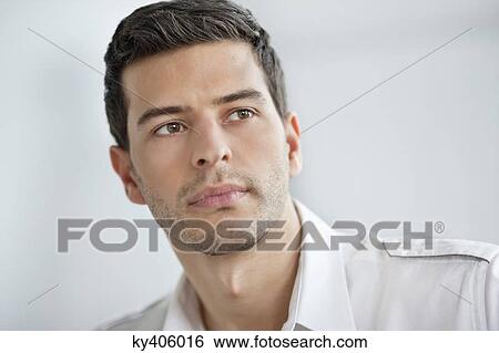 Stock Photograph - Close-up of a businessman thinking. Fotosearch