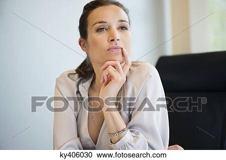 Close-up of a businesswoman thinking in an office View Large Photo Image Stock Image - Close-up of a businesswoman thinking in an office. Fotosearch