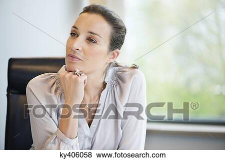 Close-up of a businesswoman thinking in an office View Large Photo Image Stock Photo - Close-up of a businesswoman thinking in an office. Fotosearch