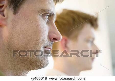 Close-up of a man with another man in the background View Large Photo Image Stock Photo - Close-up of a man with another man in the background. Fotosearch