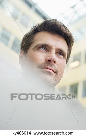 Picture - Low angle view of a man. Fotosearch