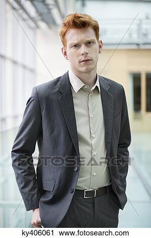 Stock Image - Portrait of a businessman in an office. Fotosearch