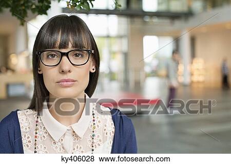 Stock Photo - Portrait of a businesswoman in an office. Fotosearch