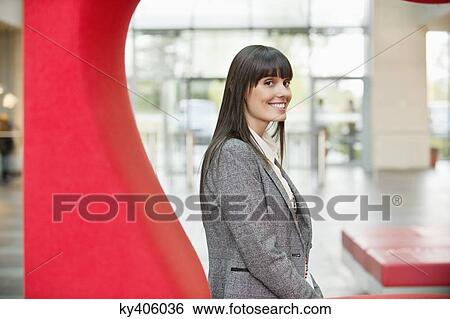 Portrait of a businesswoman smiling in an office View Large Photo Image Stock Photograph - Portrait of a businesswoman smiling in an office. Fotosearch