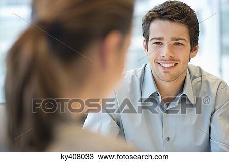 Stock Image - Business executive discussing with her client. Fotosearch