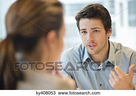 Stock Image - Business executive discussing with her client. Fotosearch