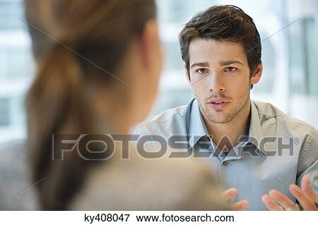Business executive discussing with her client View Large Photo Image Stock Photo - Business executive discussing with her client. Fotosearch