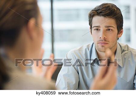 Business executive discussing with her client View Large Photo Image Stock Photo - Business executive discussing with her client. Fotosearch