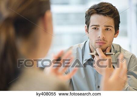 Business executive discussing with her client View Large Photo Image Stock Photography - Business executive discussing with her client. Fotosearch
