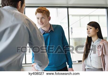 Business executive shaking hands with his clients View Large Photo Image Stock Photo - Business executive shaking hands with his clients. Fotosearch