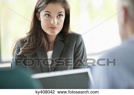 Business executives having a meeting in an office View Large Photo Image Stock Image - Business executives having a meeting in an office. Fotosearch
