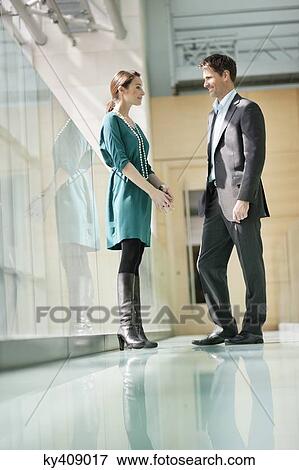 Business executives discussing in an office View Large Photo Image Stock Photo - Business executives discussing in an office. Fotosearch