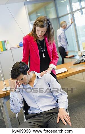 Stock Image - Business executives in an office. Fotosearch