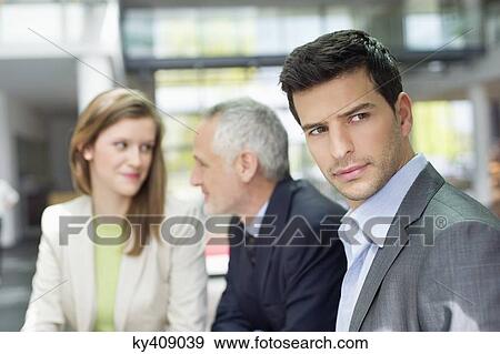 Business executives in an office View Large Photo Image Stock Photo - Business executives in an office. Fotosearch