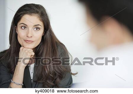 Stock Photo - Close-up of a businesswoman thinking. Fotosearch