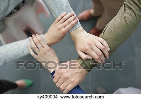 Close-up of connecting hands of business executives View Large Photo Image Picture - Close-up of connecting hands of business executives. Fotosearch