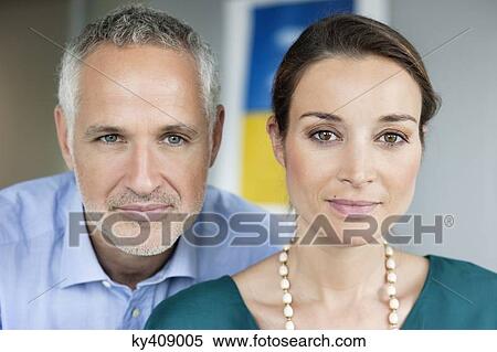 Stock Photography - Portrait of business executives in an office. Fotosearch