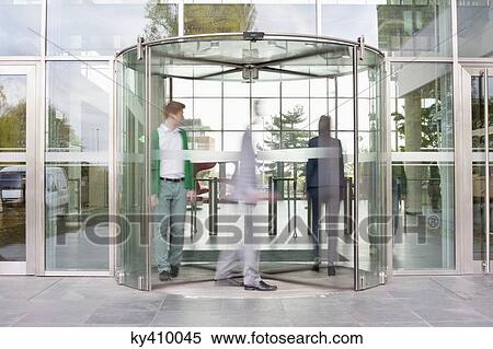 Business executives at entrance of an office building View Large Photo Image Stock Photography - Business executives at entrance of an office building. Fotosearch